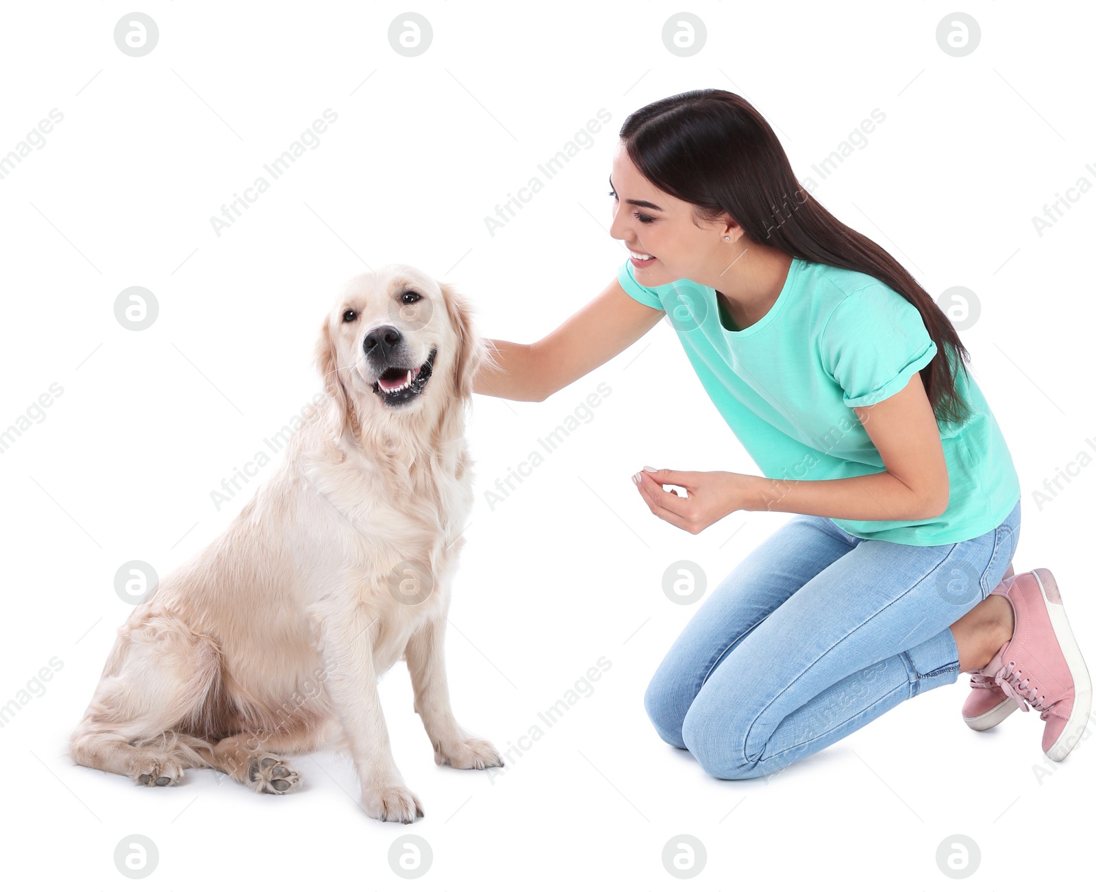 Photo of Young woman and her Golden Retriever dog on white background