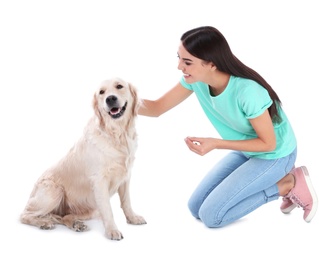 Photo of Young woman and her Golden Retriever dog on white background