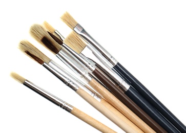Photo of Set of different paint brushes on white background