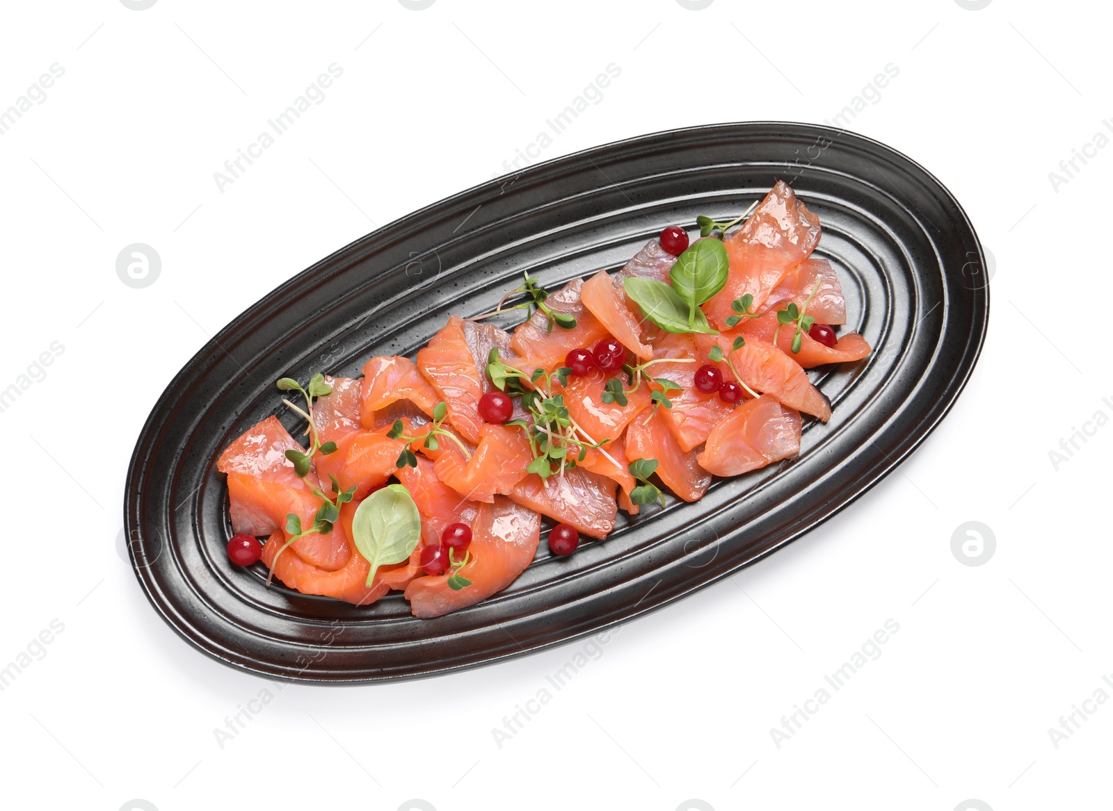 Photo of Delicious salmon carpaccio with herbs and red currants on white background, top view