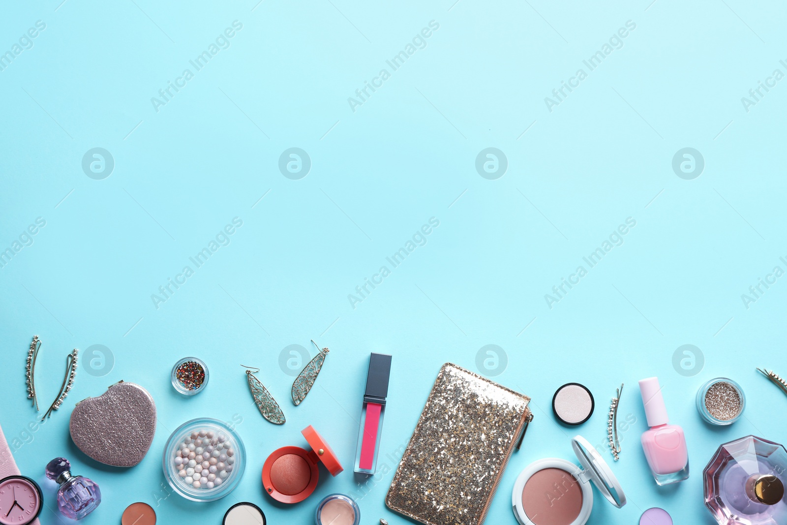 Photo of Flat lay composition with stylish female accessories and decorative cosmetics on color background, space for text