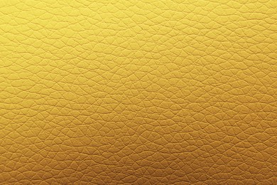 Image of Golden textured surface as background, closeup view