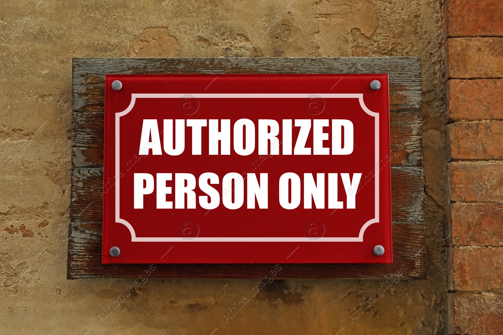 Image of Sign with text Authorized Person Only on old wall