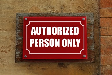 Image of Sign with text Authorized Person Only on old wall