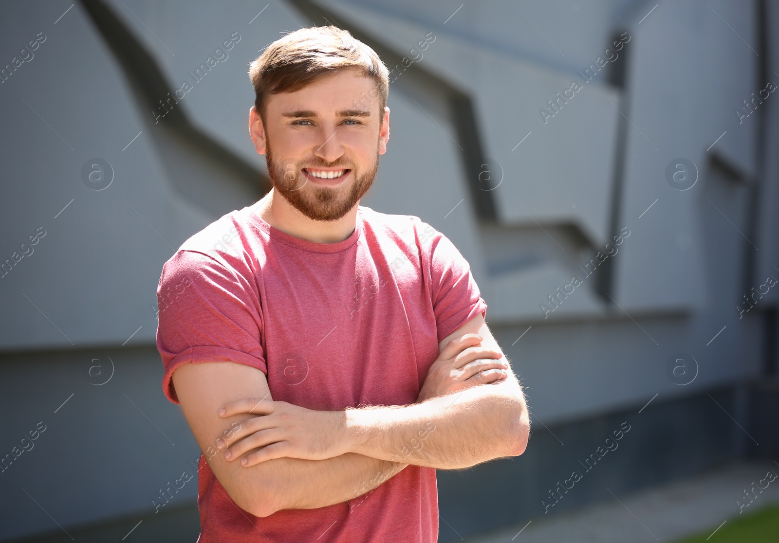 Photo of Portrait of young man in stylish outfit outdoors