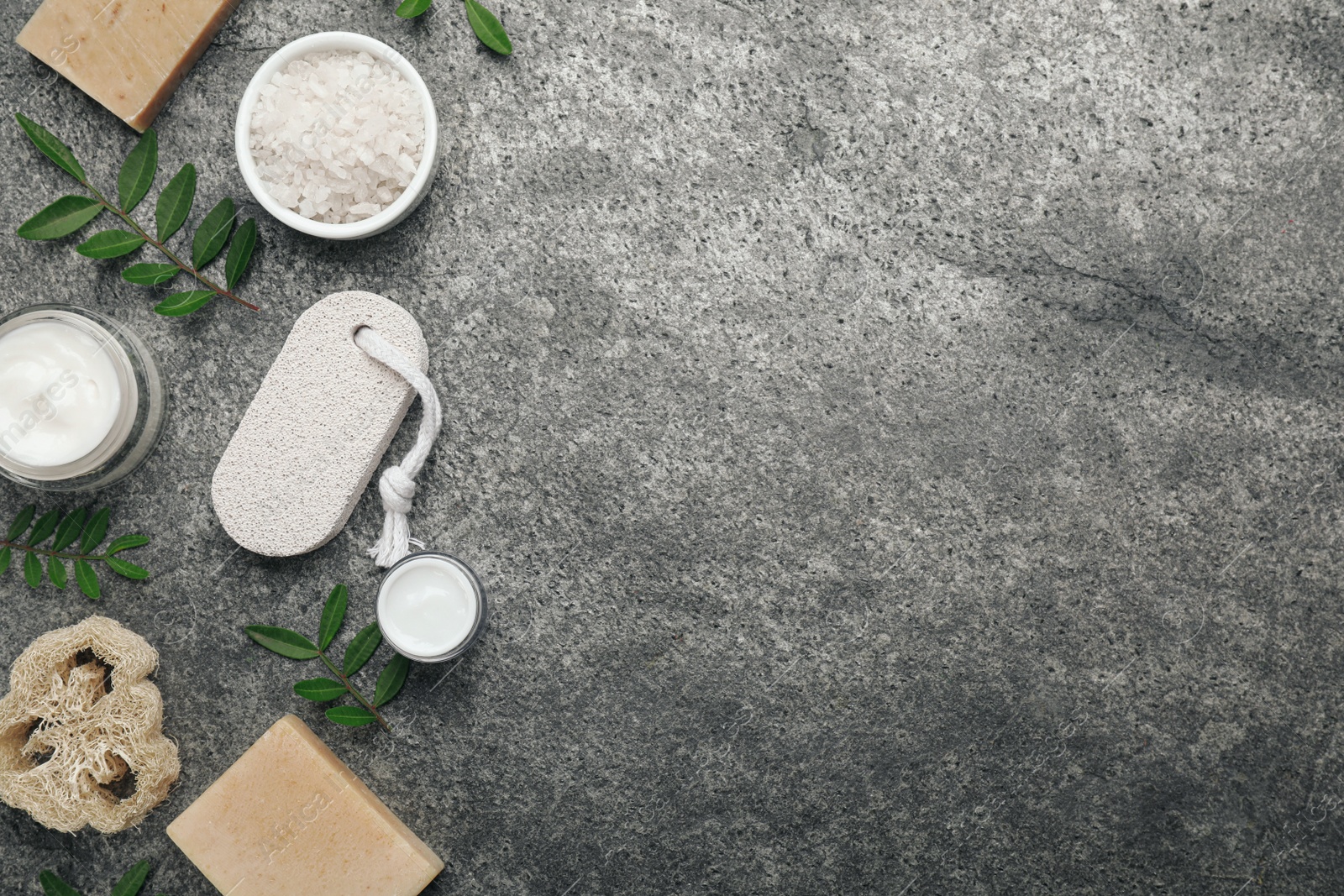 Photo of Flat lay composition with pumice stone on grey background. Space for text