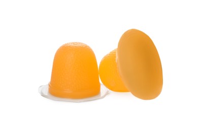 Photo of Delicious orange jelly cups on white background