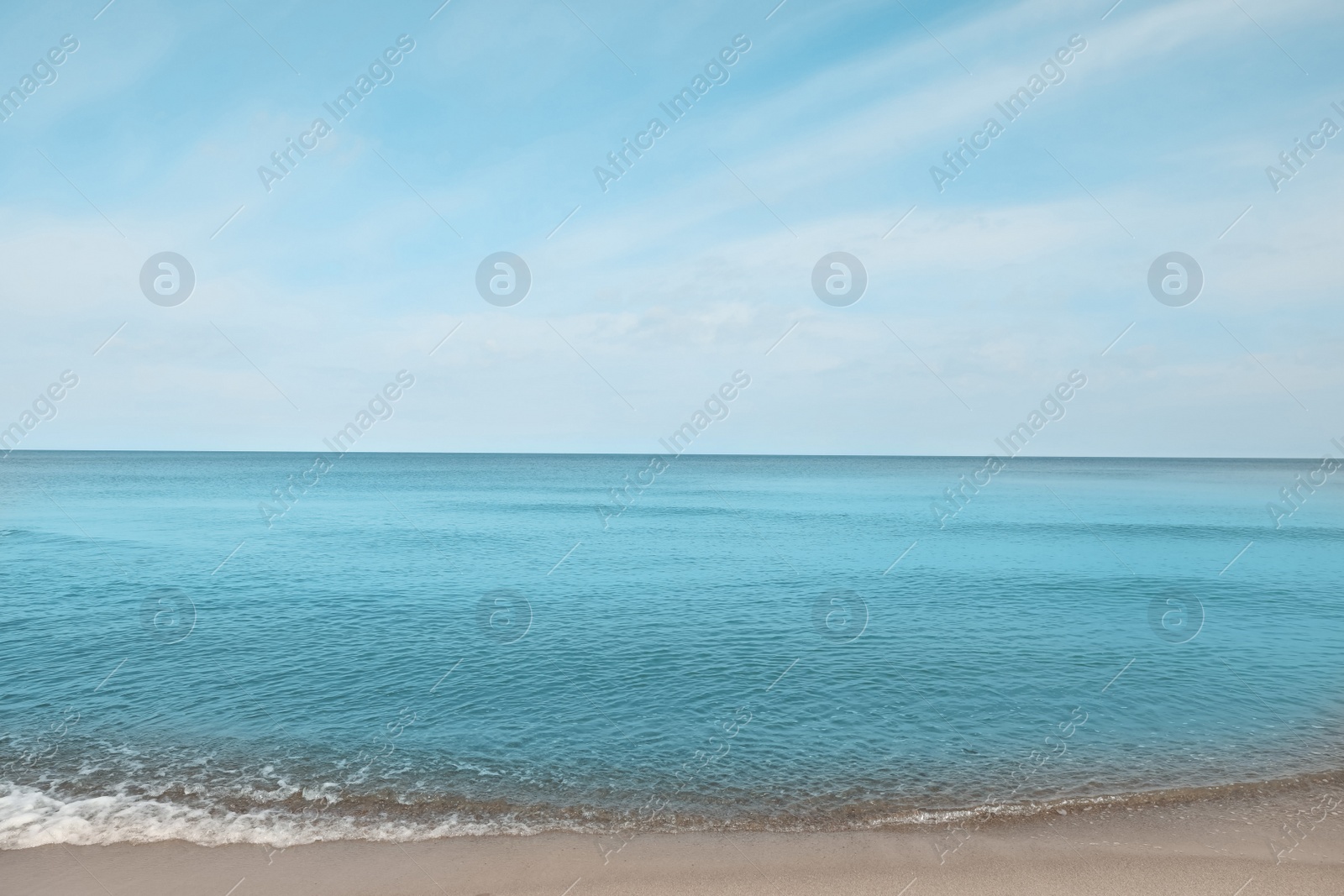 Photo of Beautiful view of sea shore under blue sky on sunny day