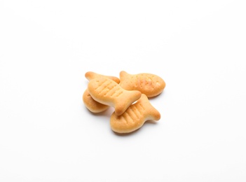 Photo of Delicious crispy goldfish crackers on white background