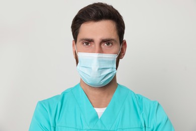 Nurse with medical mask on white background