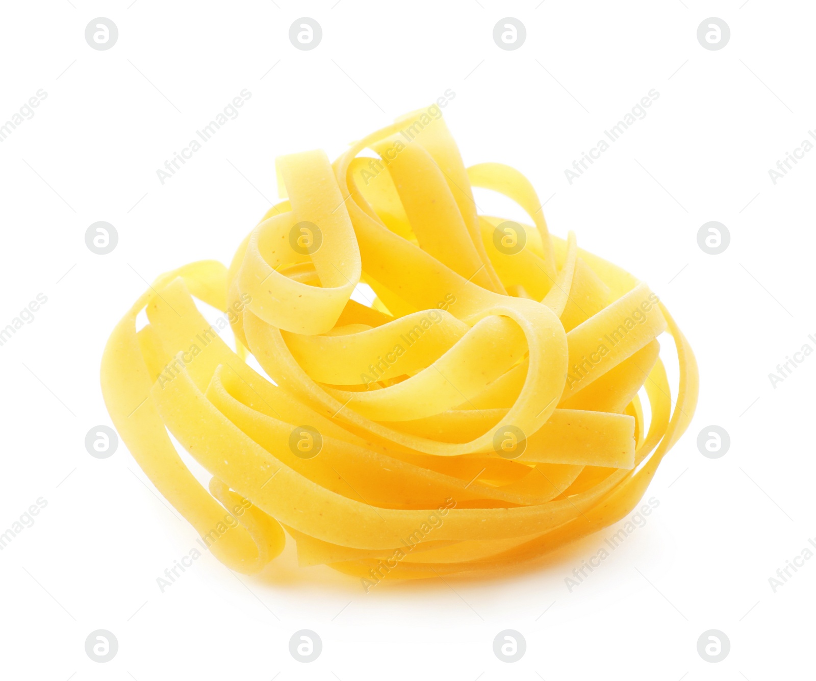 Photo of Uncooked fettuccine pasta on white background