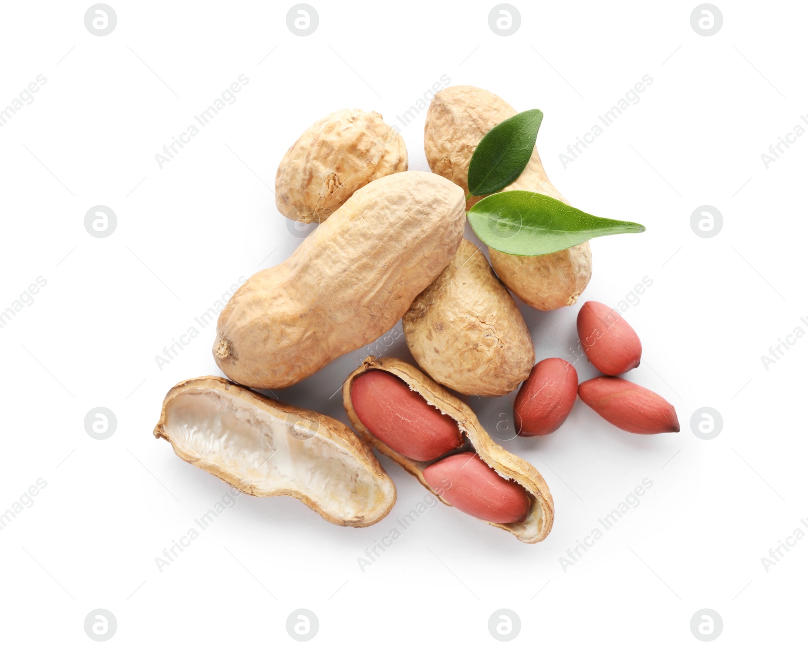 Photo of Raw peanuts and leaves on white background, top view. Healthy snack