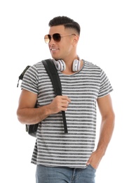 Photo of Man with backpack and headphones on white background. Summer travel