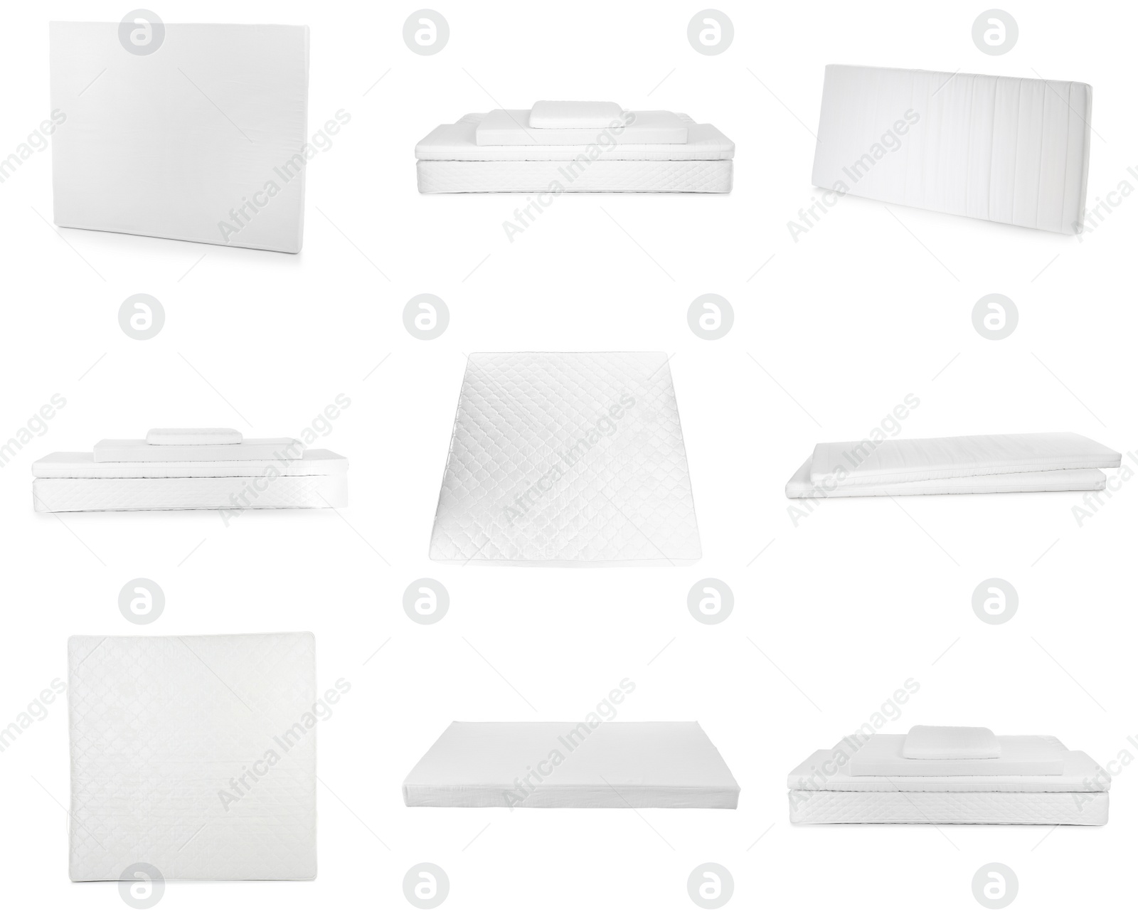 Image of Set with new comfortable mattresses on white background