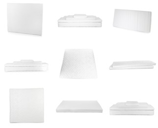 Image of Set with new comfortable mattresses on white background