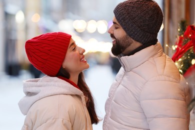 Photo of Lovely couple spending time together on city street