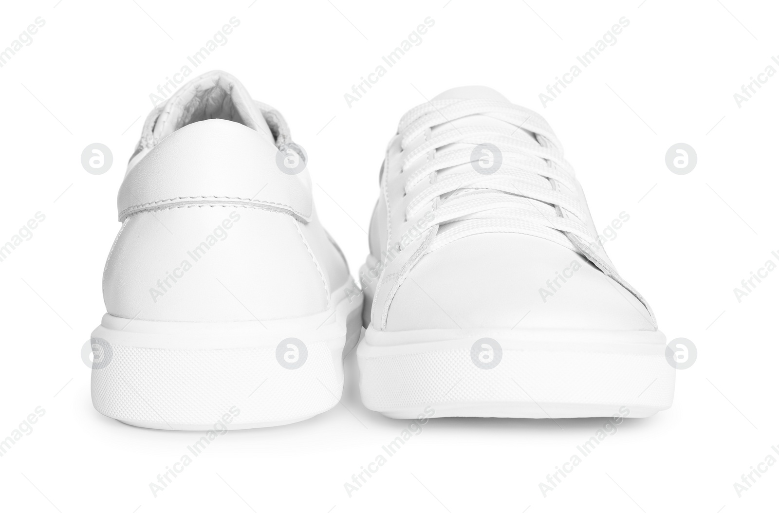 Photo of Pair of stylish sneakers isolated on white