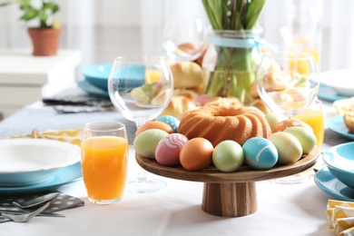 Photo of Festive Easter table setting with traditional meal, space for text