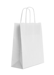 Photo of Blank paper bag isolated on white. Mockup for design