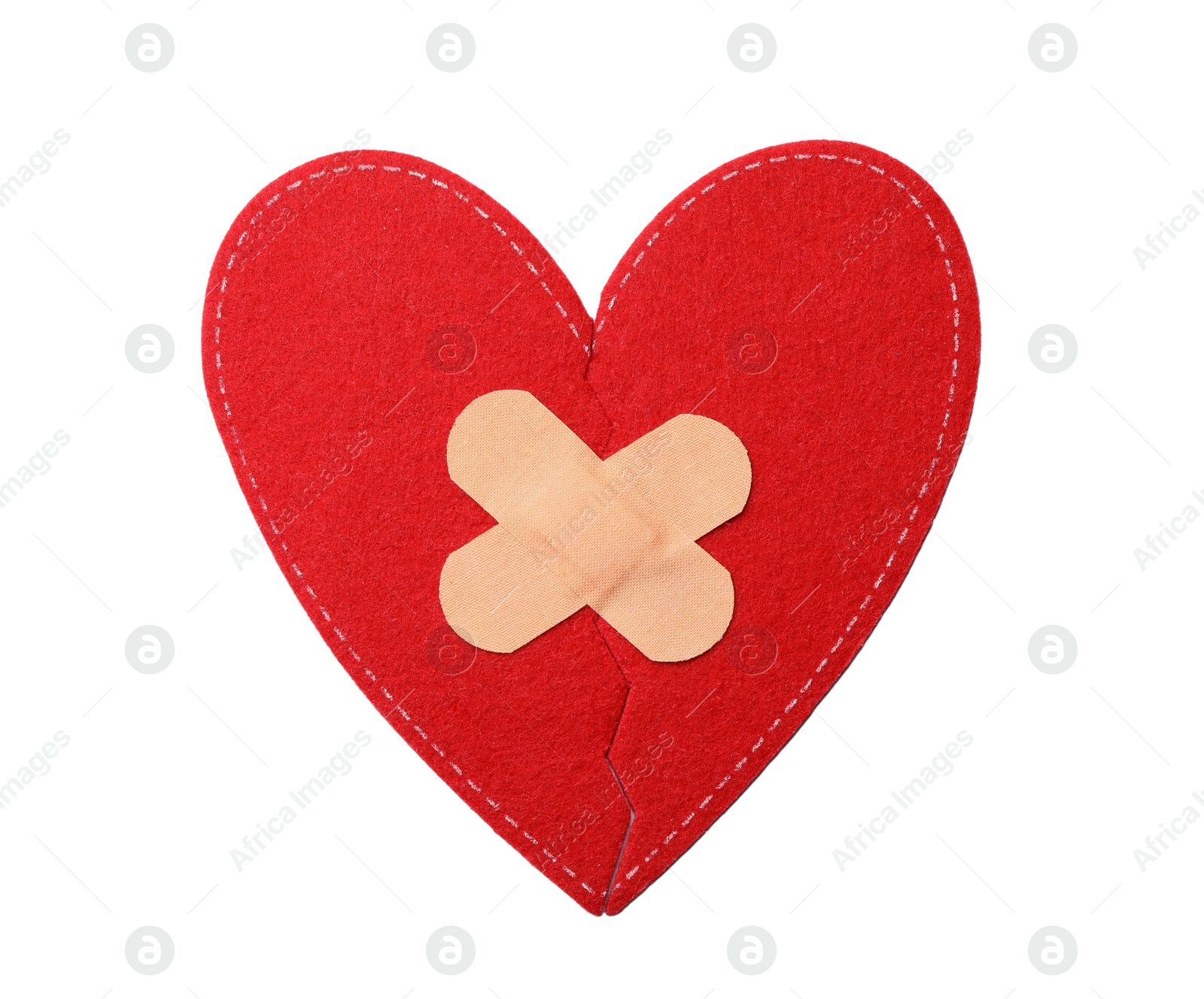 Photo of Red fabric heart with sticking plasters isolated on white, top view