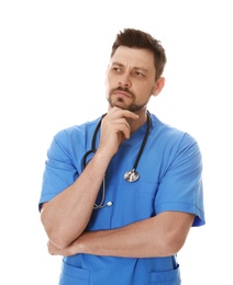 Photo of Portrait of pensive male doctor in scrubs isolated on white. Medical staff