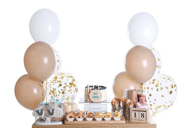 Baby shower party. Different delicious treats and decor on wooden table against white background