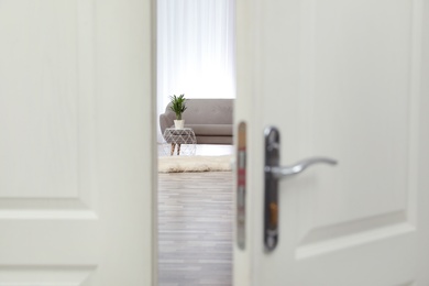 Stylish room interior, view through open door