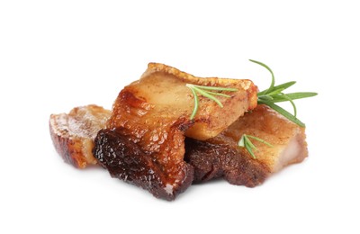 Photo of Tasty fried cracklings with rosemary on white background. Cooked pork lard
