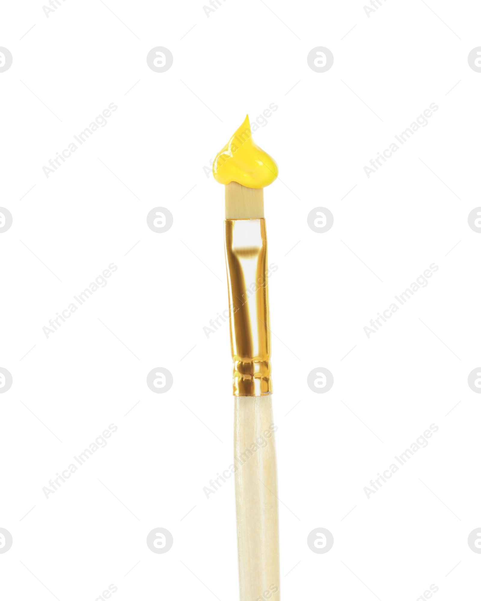 Photo of Brush with yellow paint on white background