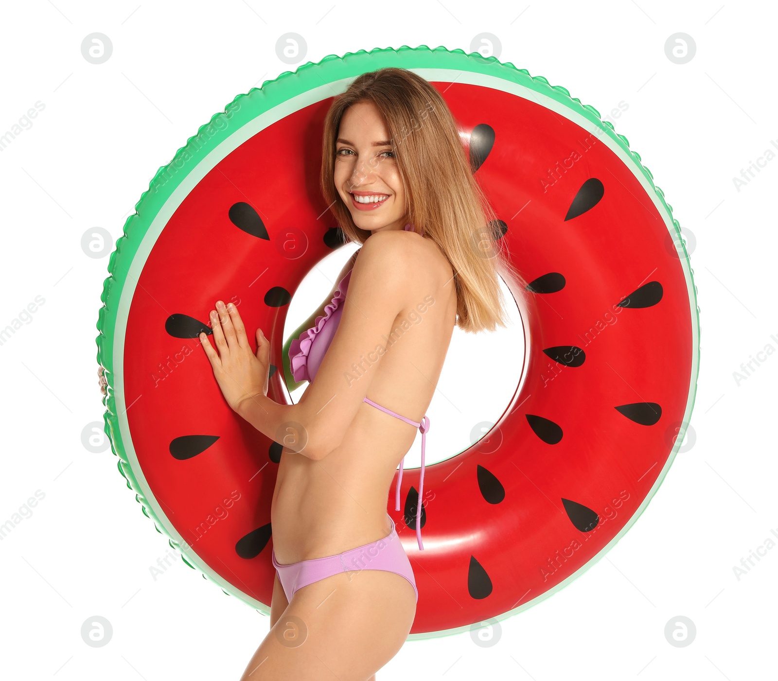 Photo of Beautiful young woman in stylish bikini with watermelon inflatable ring on white background