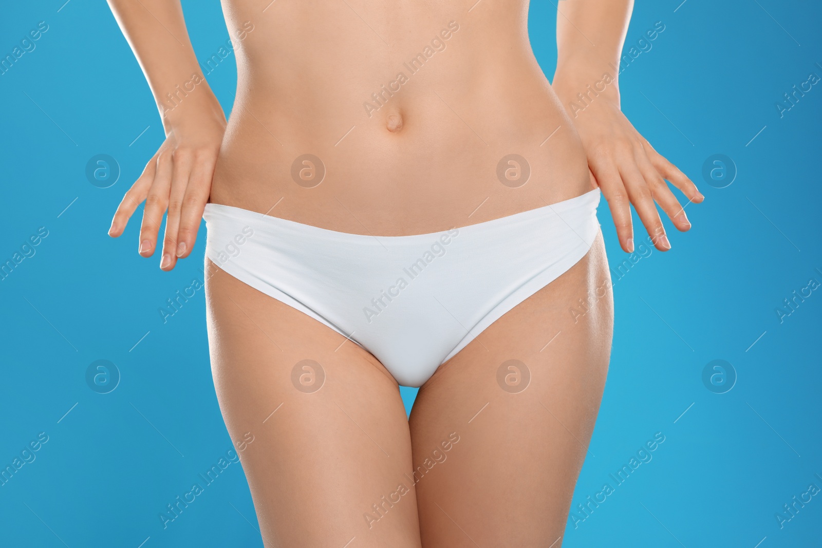 Photo of Slim young woman with smooth gentle skin on color background, closeup. Beauty and body care concept