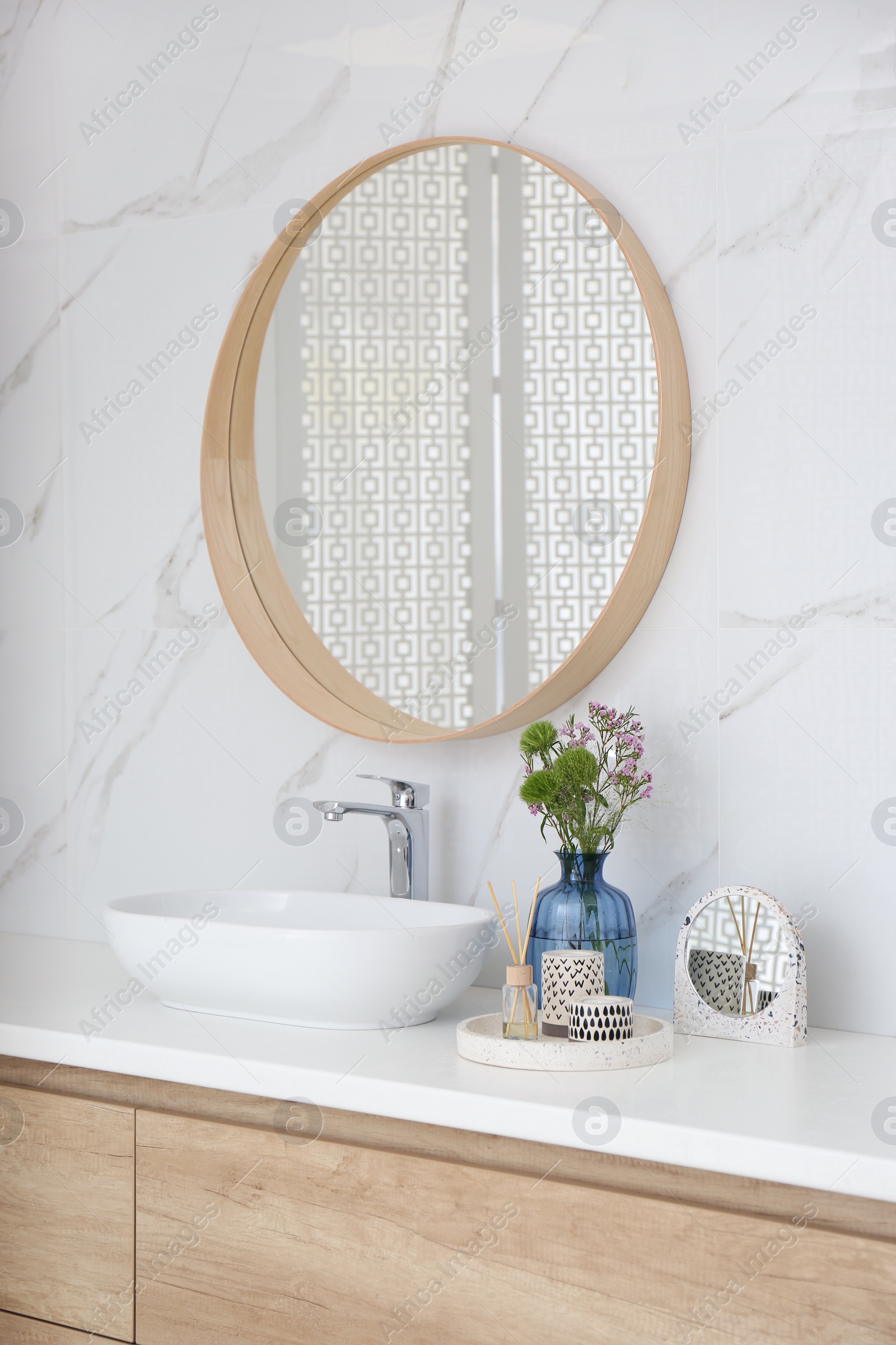 Photo of Modern bathroom interior with stylish mirror and vessel sink