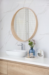 Photo of Modern bathroom interior with stylish mirror and vessel sink