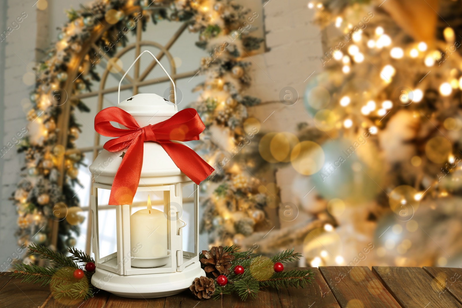 Image of Composition with Christmas lantern on table in decorated room, space for text