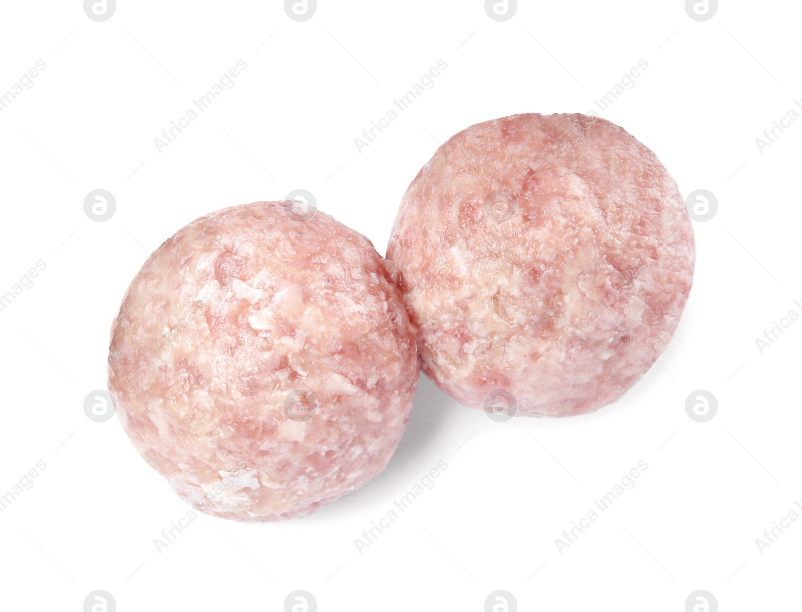 Photo of Two fresh raw meatballs isolated on white, top view