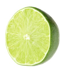 Photo of Half of fresh green ripe lime isolated on white