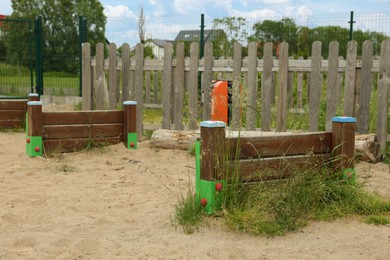 Photo of Wooden rover jump over on animal training area outdoors