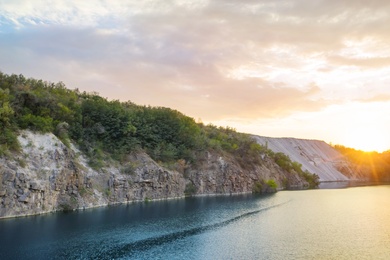 Beautiful blue lake with granite banks at sunset