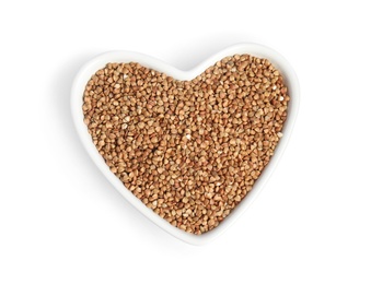 Photo of Bowl with uncooked buckwheat on white background, top view