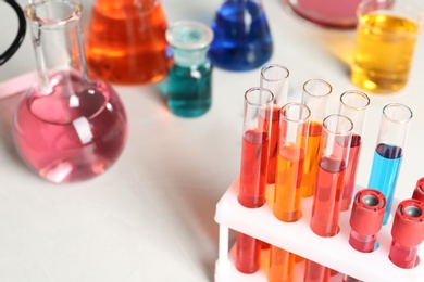 Photo of Test tubes with samples in chemistry laboratory, closeup. Space for text