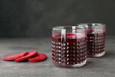 Photo of Glasses with fresh healthy beet juice on table