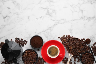 Coffee maker, beans, powder and cup of drink on white marble table, flat lay. Space for text