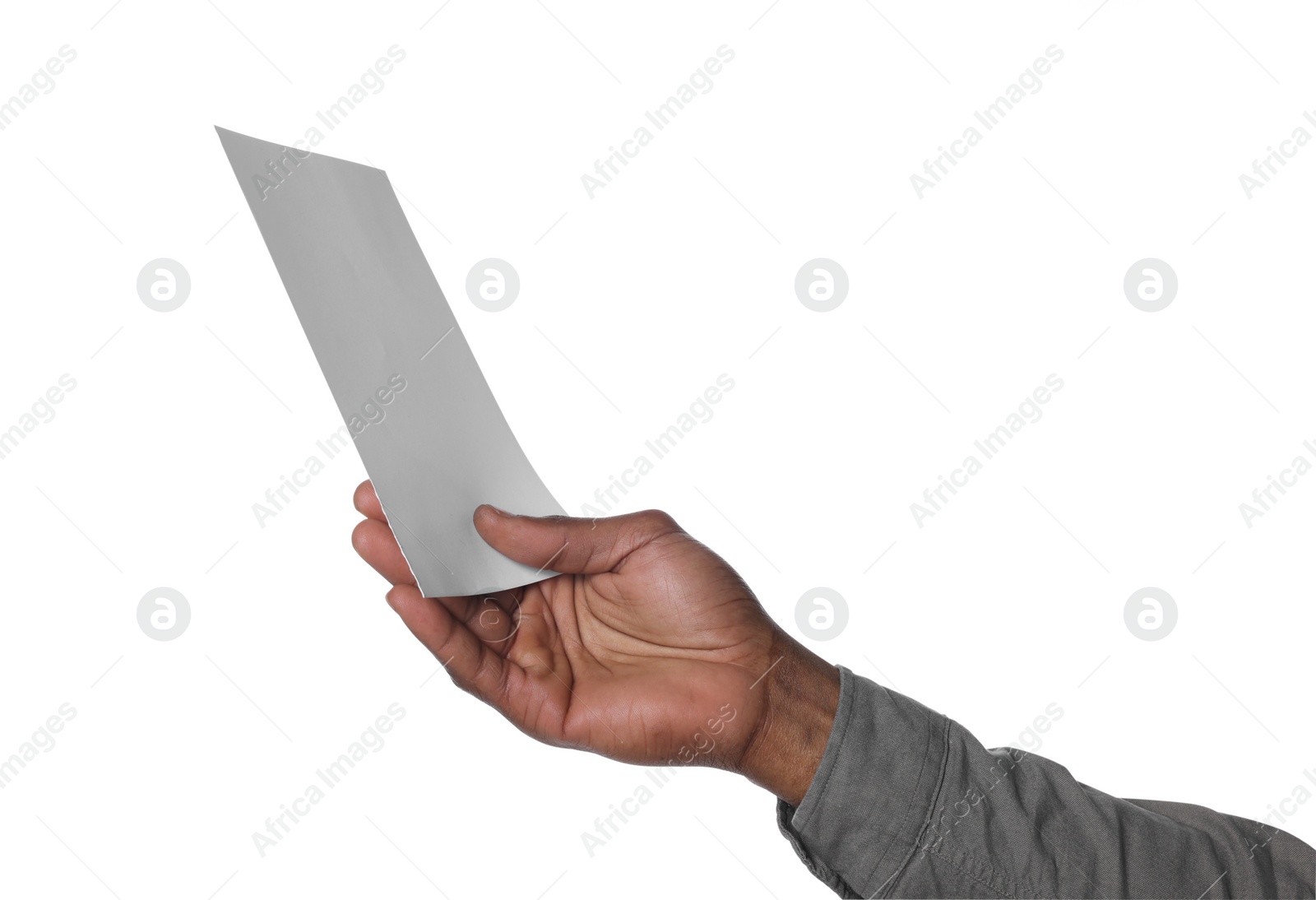 Photo of African American man holding sheet of paper on white background, closeup. Mockup for design