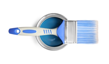 Photo of Can of blue paint and brush on white background, top view