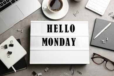 Image of Hello Monday, start your week with good mood. Flat lay composition with lightbox and office supplies on grey table