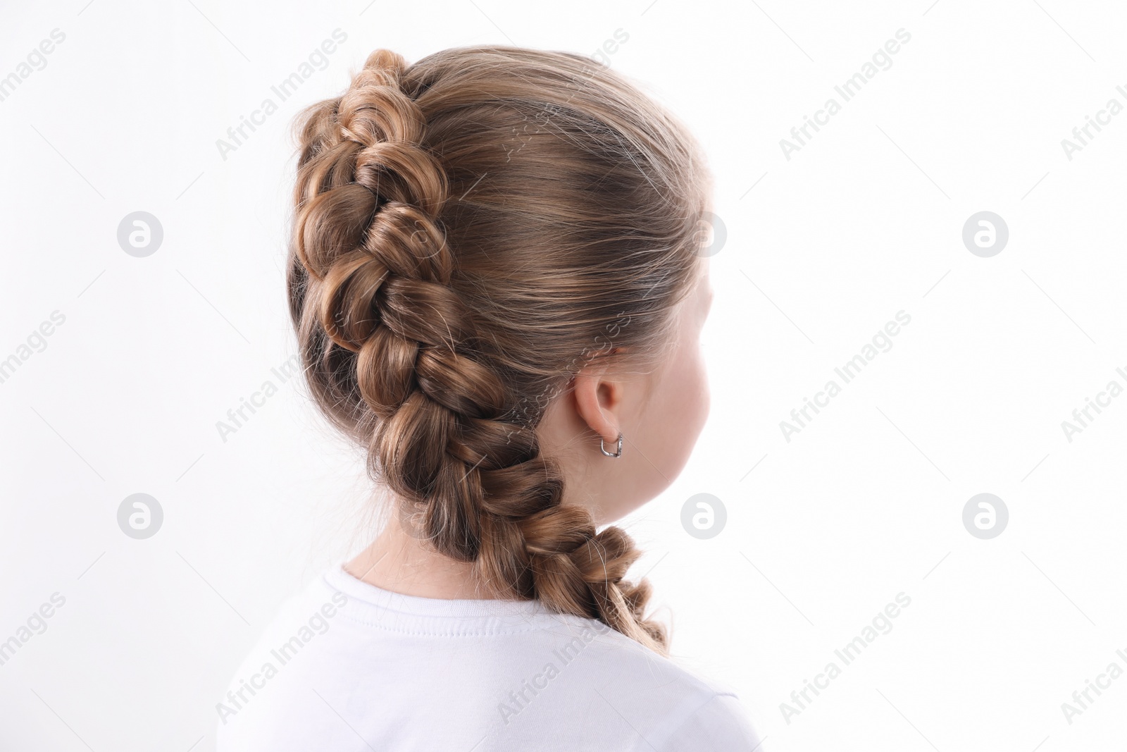 Photo of Little girl with braided hair on white background, back view
