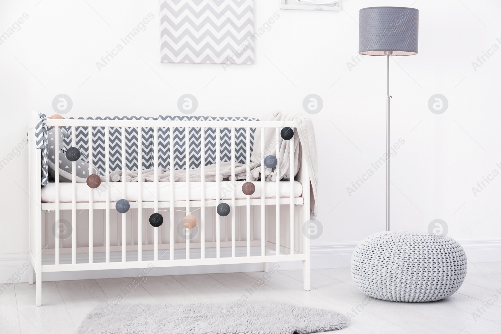 Photo of Baby room interior with comfortable crib