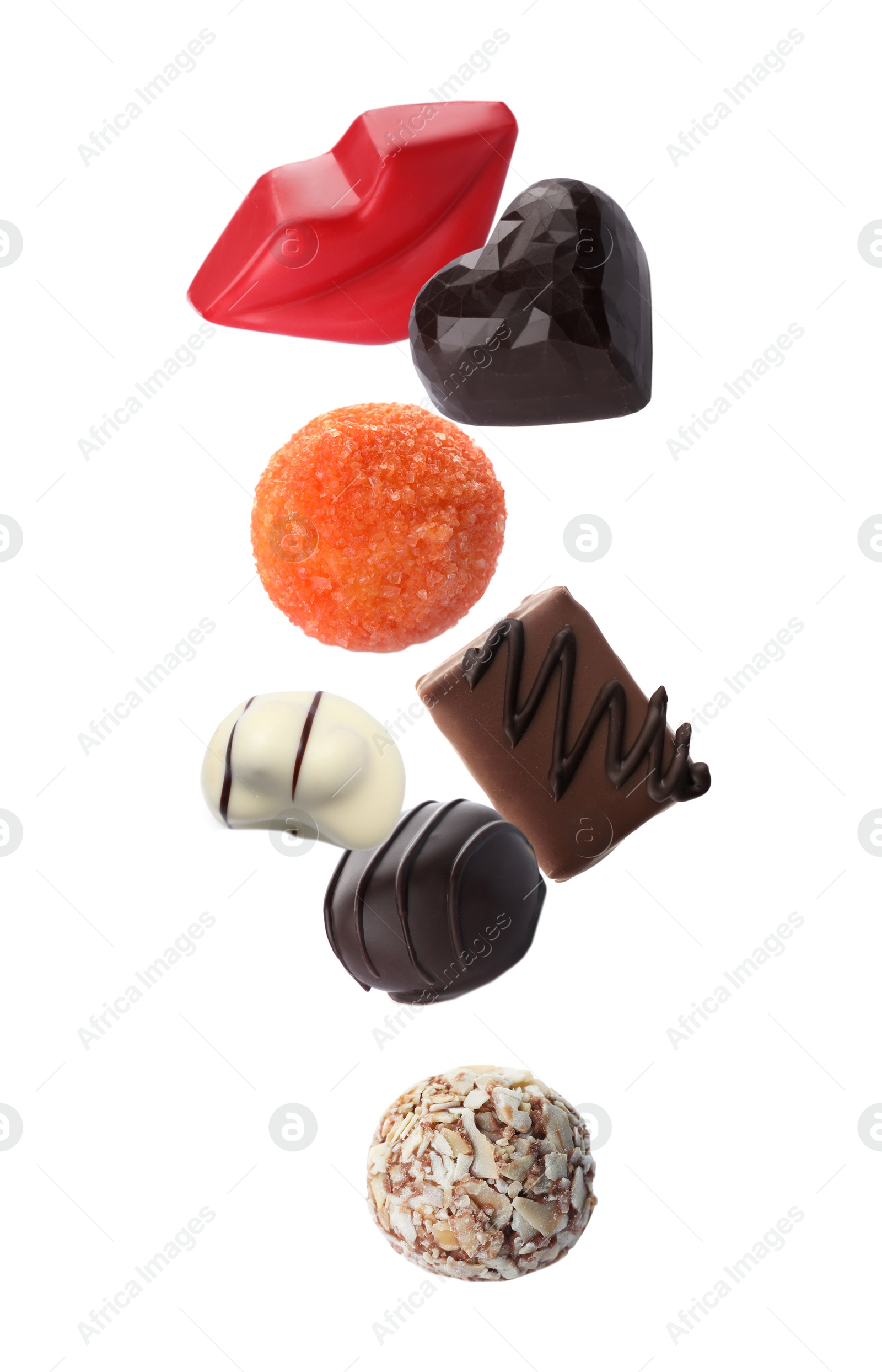 Image of Different chocolate candies falling on white background