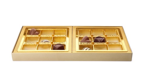 Photo of Partially empty box of chocolate candies isolated on white