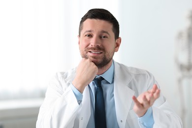 Photo of Portrait of professional doctor on blurred background